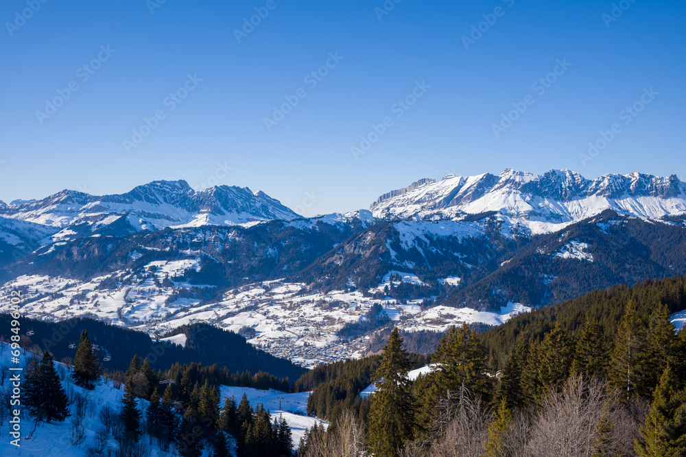 The city of Megeve in the middle of the mountains of the Mont Blanc massif in Europe, France, Rhone Alpes, Savoie, Alps, in winter, on a sunny day.