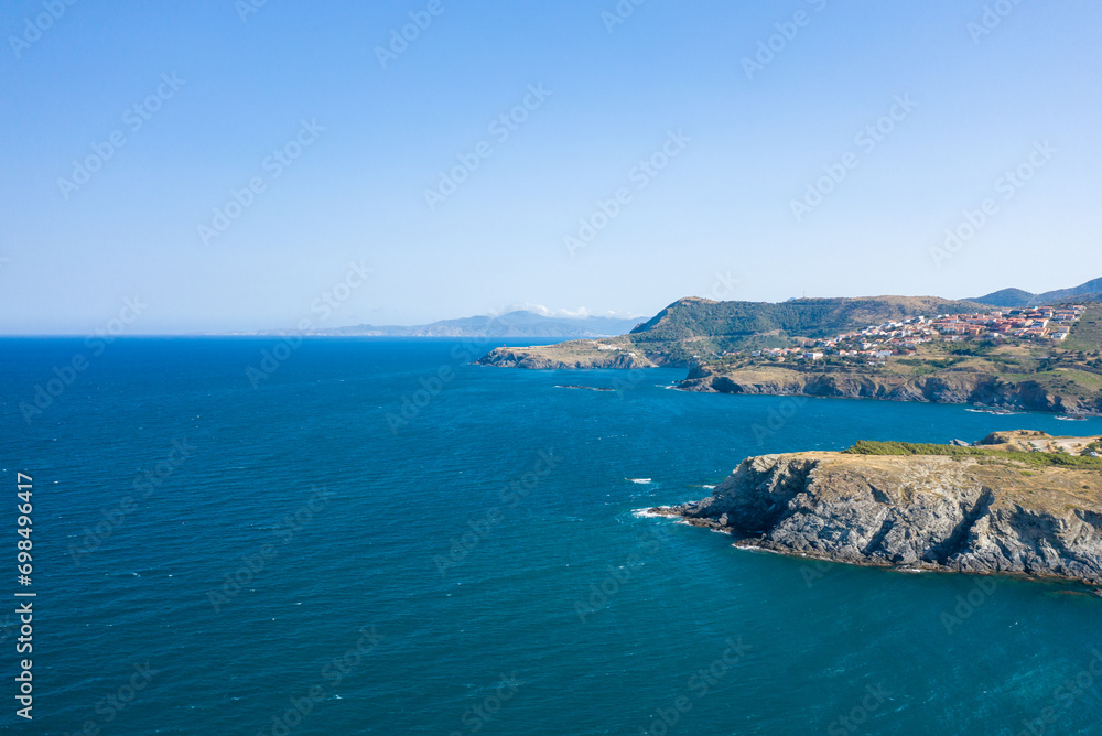 The arid rocky coast in Europe, France, Occitanie, Pyrenees Orientales, Banyuls-sur-Mer, By the Mediterranean Sea, in summer, on a sunny day.