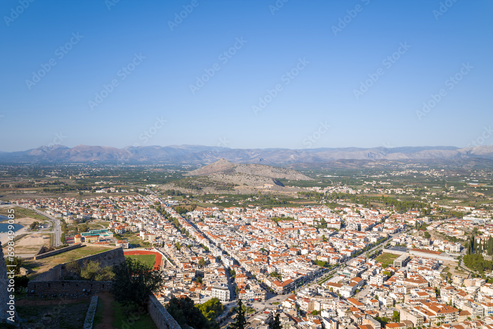 A panoramic view of the city center and arid countryside , Europe, Greece, Peloponnese, Argolis, Nafplion, Myrto seaside, in summer on a sunny day.