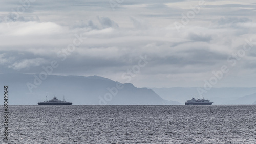 A ferry sailing on the Trondheim Fjord. Dramatic clouds before storm and mountains. © Jedrzej