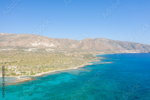 The rocky coast and its arid mountains   in Europe  Greece  Crete  Elafonisi  By the Mediterranean Sea  in summer  on a sunny day.