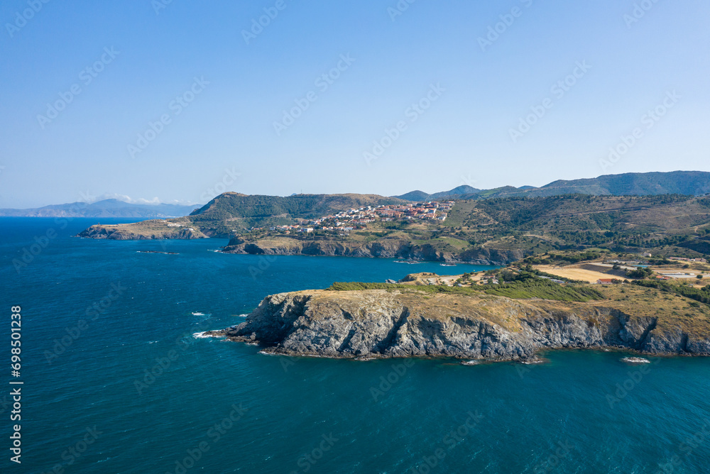 The city of Cerbere on the rocky coast in Europe, France, Occitanie, Pyrenees Orientales, Cerbere, By the Mediterranean Sea, in summer, on a sunny day.