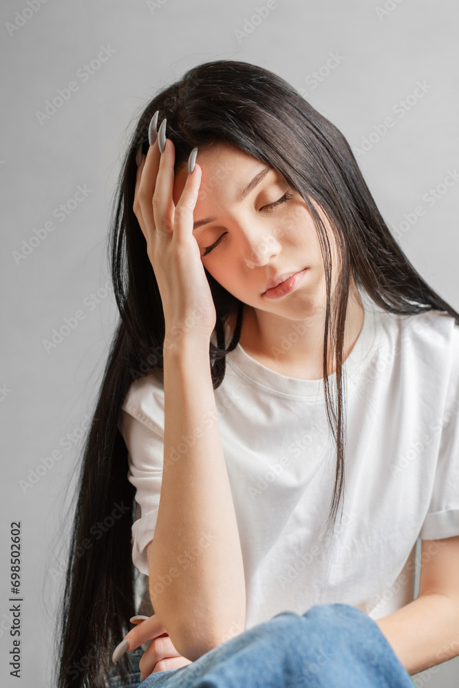 Portrait of a young girl who looks sad. Portrait of a young girl who looks sad.
