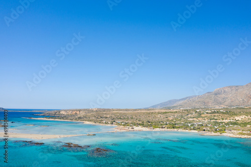 Fototapeta Naklejka Na Ścianę i Meble -  The sandy beach and its heavenly colored water, in Europe, Greece, Crete, Elafonisi, By the Mediterranean Sea, in summer, on a sunny day.