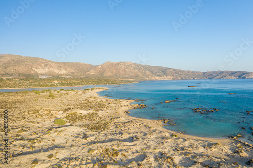 The sandy beach and its heavenly colored water, in Europe, Greece, Crete, Elafonisi, By the Mediterranean Sea, in summer, on a sunny day.