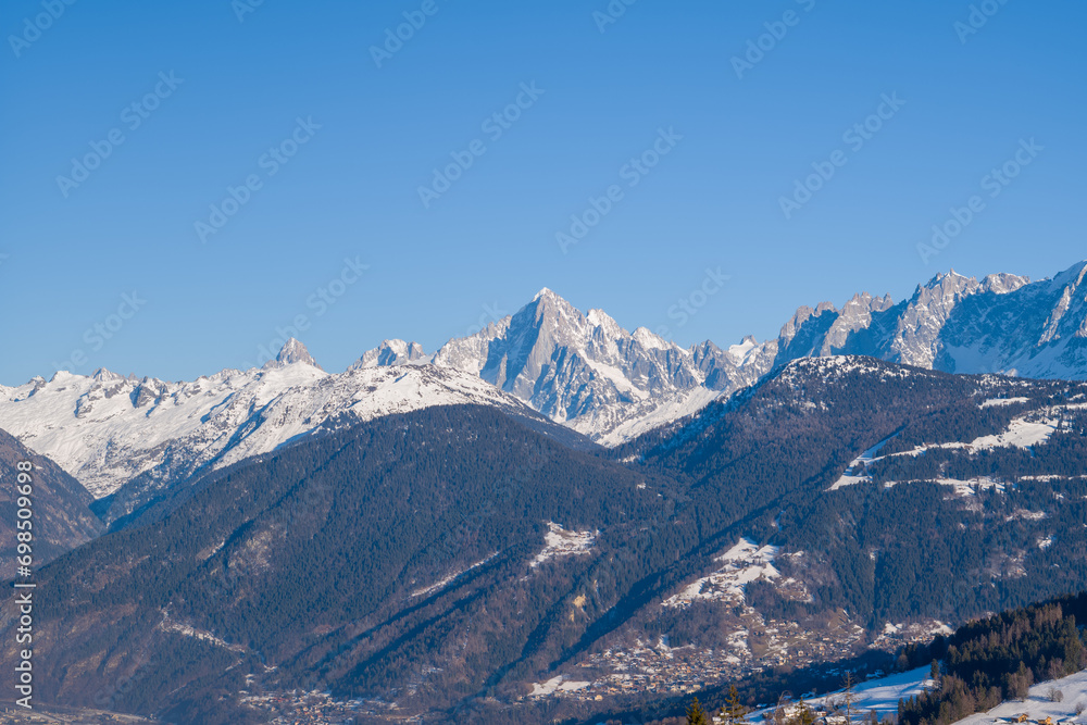 The panoramic view of Aiguille Verte in Europe, France, Rhone Alpes, Savoie, Alps, in winter on a sunny day. The panoramic view of Aiguille Verte in Europe, France, Rhone Alpes, Savoie, Alps, in winter on a sunny day.