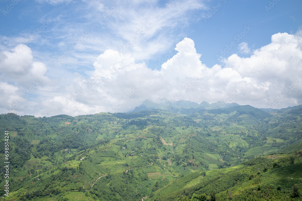 Green mountains and forests , in Asia, Vietnam, Tonkin, Bac Ha, towards Lao Cai, in summer, on a sunny day.