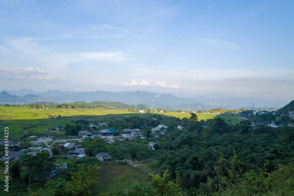 A traditional village in the middle of countryside and mountains, in Asia, Vietnam, Tonkin, towards Hanoi, Mai Chau, in summer, on a sunny day. A traditional village in the middle of countryside and mountains, in Asia, Vietnam, Tonkin, towards Hanoi, Mai Chau, in summer, on a sunny day.