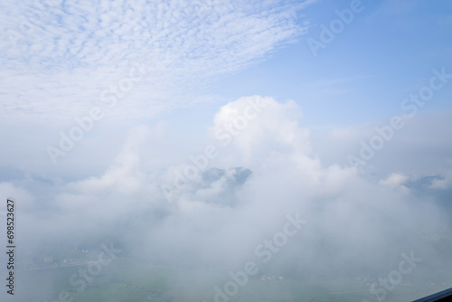 The valley dominated by clouds and fog in the middle of the mountains, in Asia, in Vietnam, in Tonkin, towards Hanoi, in Mai Chau, in summer, on a sunny day. © Florent