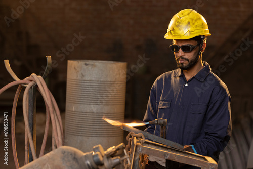 Photography Portrait of Male welder working at factory