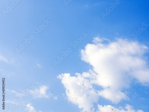 blue sky background with tiny white clouds