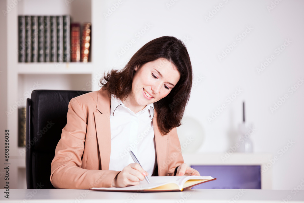 Young professional woman working at the office Young professional woman working at the office