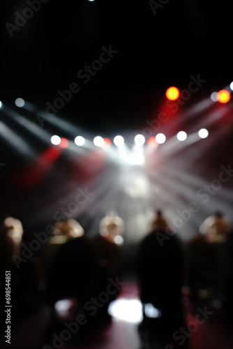 Defocused entertainment concert lighting on stage, blurred disco party and Concert Live. © Leo Li