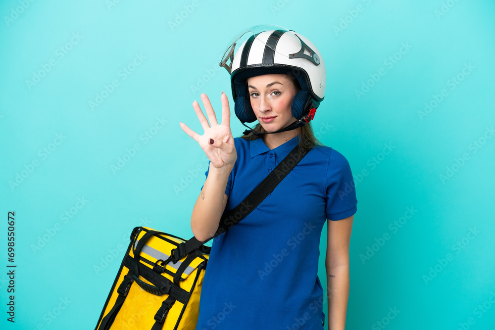 Young caucasian woman with thermal backpack isolated on white background happy and counting four with fingers Young caucasian woman with thermal backpack isolated on white background happy and counting four with fingers