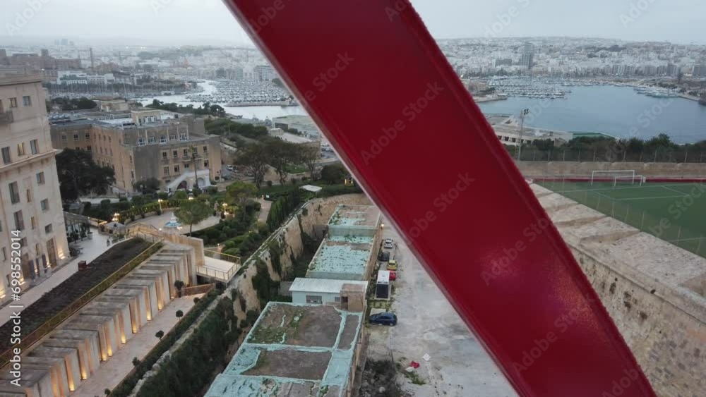 Valeta, Malta, 23.12.2023 - Floriana and Valleta footbal court view from the Ferries wheel in Fairyland. High quality 4k footage Valeta, Malta, 23.12.2023 - Floriana and Valleta footbal court view from the Ferries wheel in Fairyland. High quality 4k footage