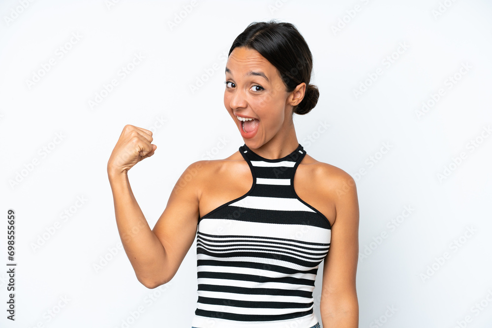 Young hispanic woman isolated on white background doing strong gesture Young hispanic woman isolated on white background doing strong gesture