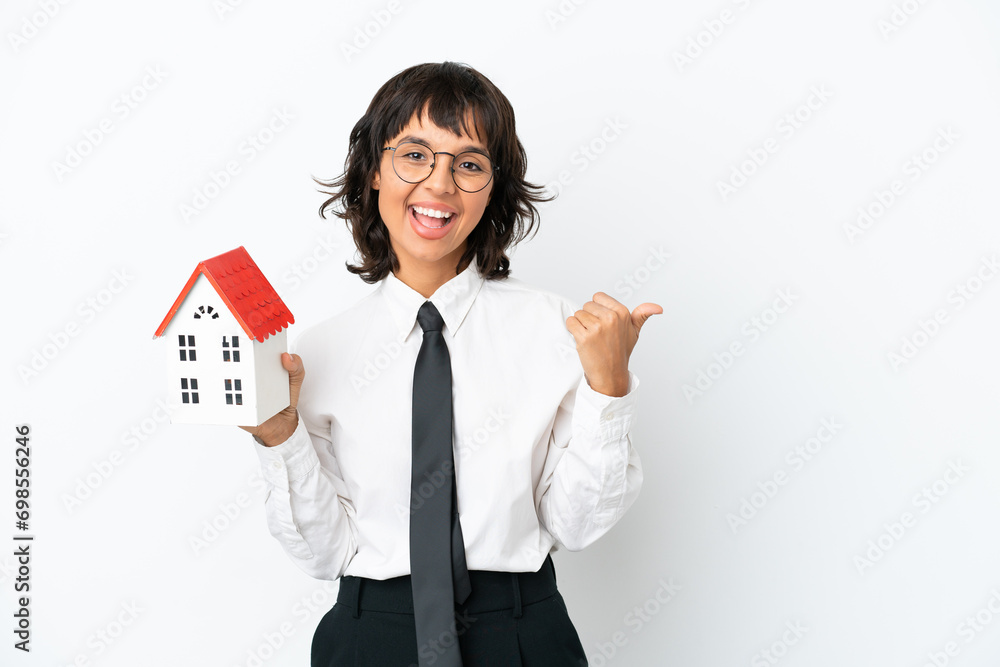 Real estate mixed race agent isolated on white background pointing to the side to present a product Real estate mixed race agent isolated on white background pointing to the side to present a product
