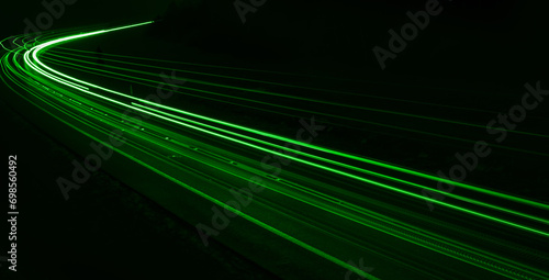 green car lights at night. long exposure photo