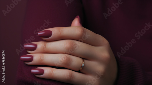 Beautiful burgundy nails of a model