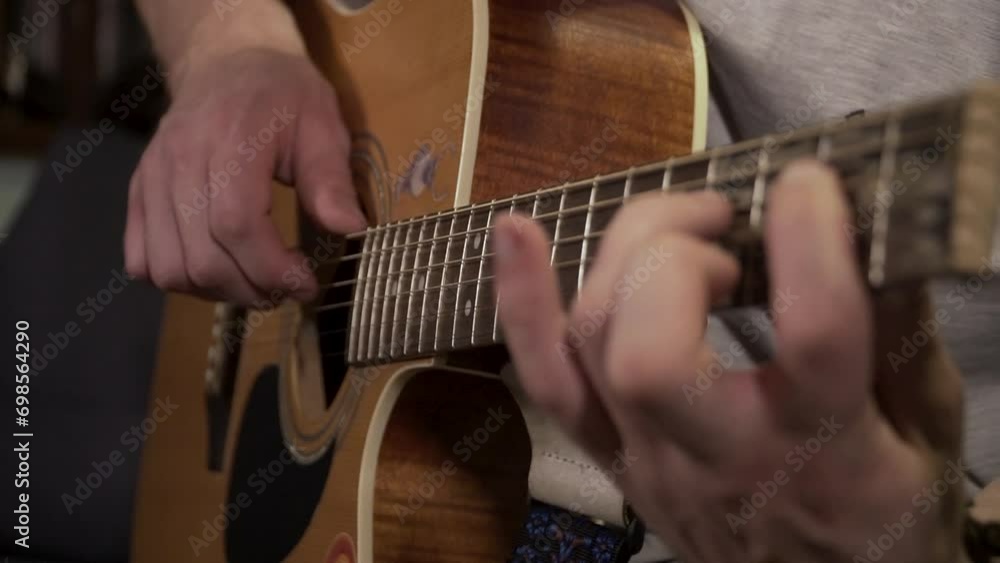 a man playing guitar in the winter night in the room a man playing guitar in the winter night in the room