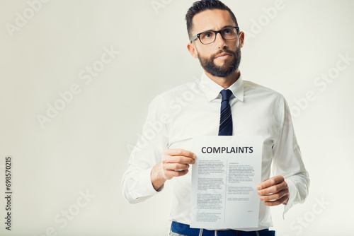 Professional evaluates customer complaints document photo