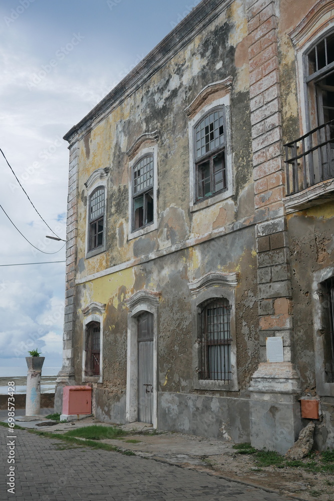 Old faded facade of a colonial house on Mozambique Island