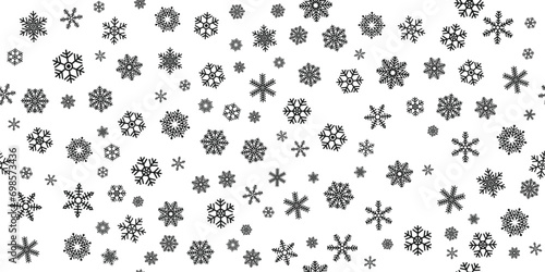 A background of snowflakes dotted randomly across a white canvas. Beautiful stylish snowflakes scattered in a seamless pattern.