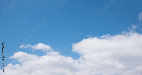 horizontal sky background, blue above and clouds in the lower half