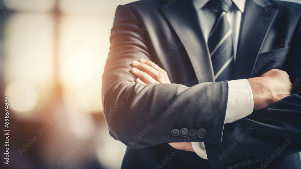 Close-up shot of business man employee with arms crossed