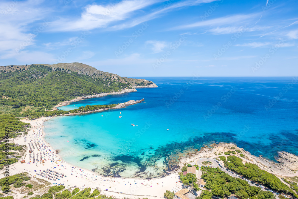 Aerial view of Cala Agulla and beautiful coast at Cala Ratjada, Mallorca: pristine beach, crystal waters, surrounded by nature, perfect Mediterranean escape.
