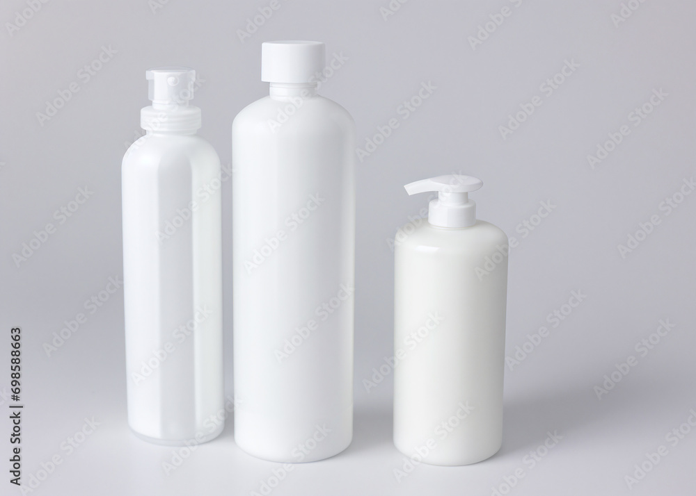 A group of white bottles, cosmetics, soap, cream. A group of white bottles, cosmetics, soap, cream.