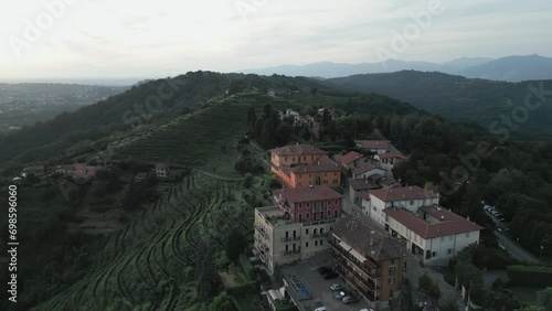 Aerial shot of the little village of Montevecchia, Italy. Stunning architecture and beautiful forests around. 4K drone shot. photo