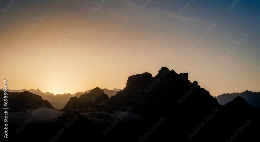 sunset with blue sky and clouds in the mountains in the desert of Egypt
