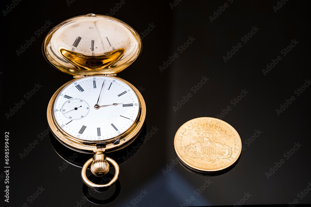 gold pocket watch and gold coins