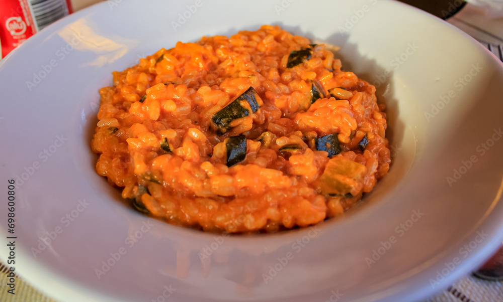 Close-up of the classic Risotto with sunlight. Italian food and cultures. Food concept. Close-up of the classic Risotto with sunlight. Italian food and cultures. Food concept.