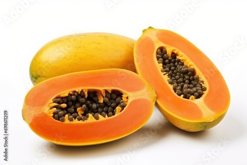 Orange papaya whole and cut in half on white background. Tropical exotic fruit, healthy food. Object composition for your design