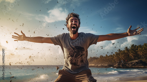 Man with arms outstretched in joy on a sunny beach with people in the background. photo
