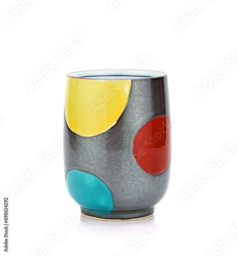 Colorful patterned ceramic cup isolated on white background
