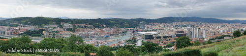 Panoramic aerial exterior view at the Bilbao downtown city, Nervion river and iconic buildings