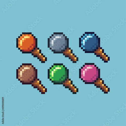 Pixel art sets of wizard staff icon with variation color item asset. staff icon on pixelated style. 8bits perfect for game asset or design asset element for your game design asset