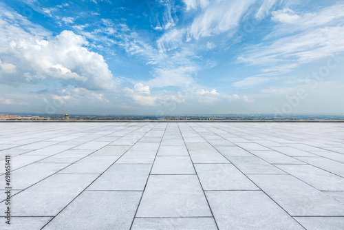 Empty brick floor and sky clouds background