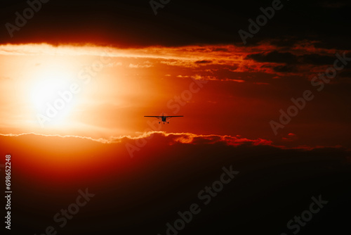 sunset in the sky with plane