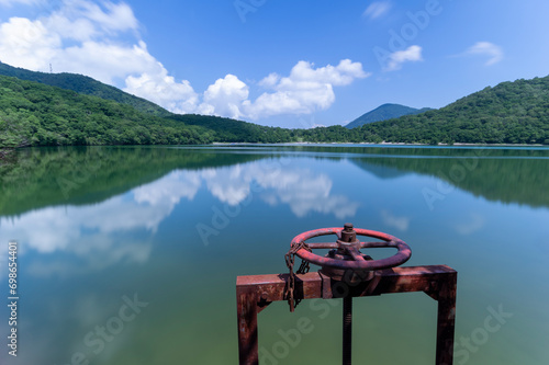 夏の赤城小沼と赤い水門ハンドル photo