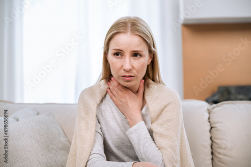young sad woman with throat sore feeling unwell