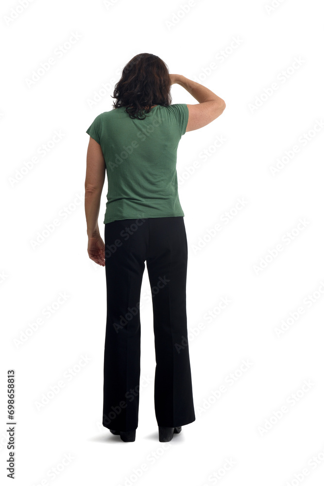 back view of a woman with her hand on her forehead looking into the distance on white background back view of a woman with her hand on her forehead looking into the distance on white background