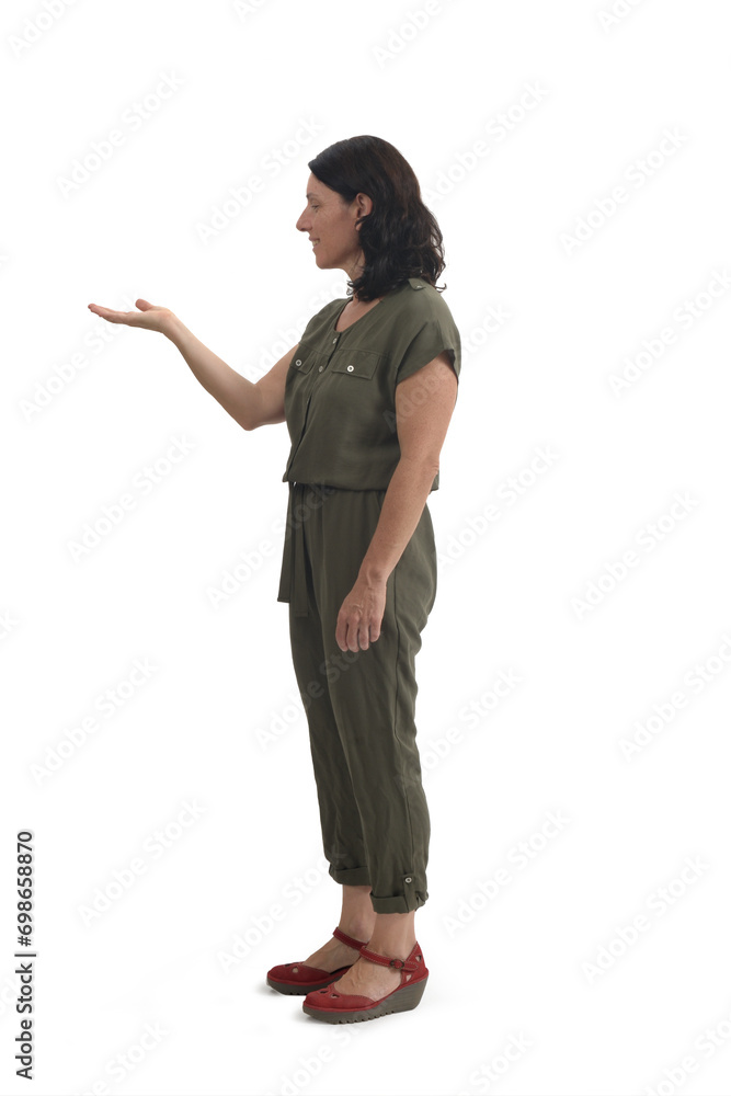 side view of woman showing and looking at an imaginary object in her hand on white background side view of woman showing and looking at an imaginary object in her hand on white background