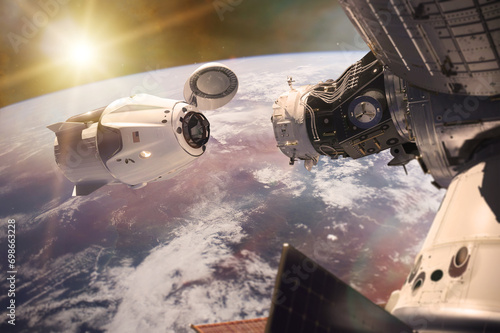 Fototapeta Naklejka Na Ścianę i Meble -  Cargo spacecraft in low-Earth orbit with sunlight. Elements of this image furnished by NASA.