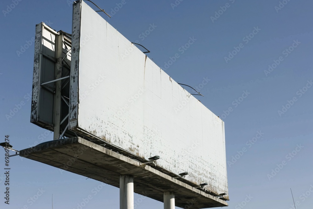 Rusty White Sign with Blue Sky Background Rusty White Sign with Blue Sky Background