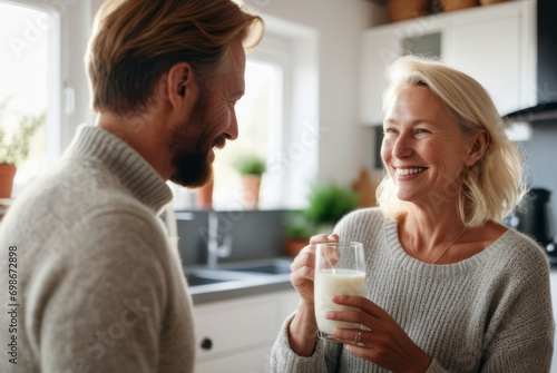 The happiness of a senior male and female couple drinking milk. For strong health  strengthen bones  nourishing the brain  concepts of taking care of your health and body.