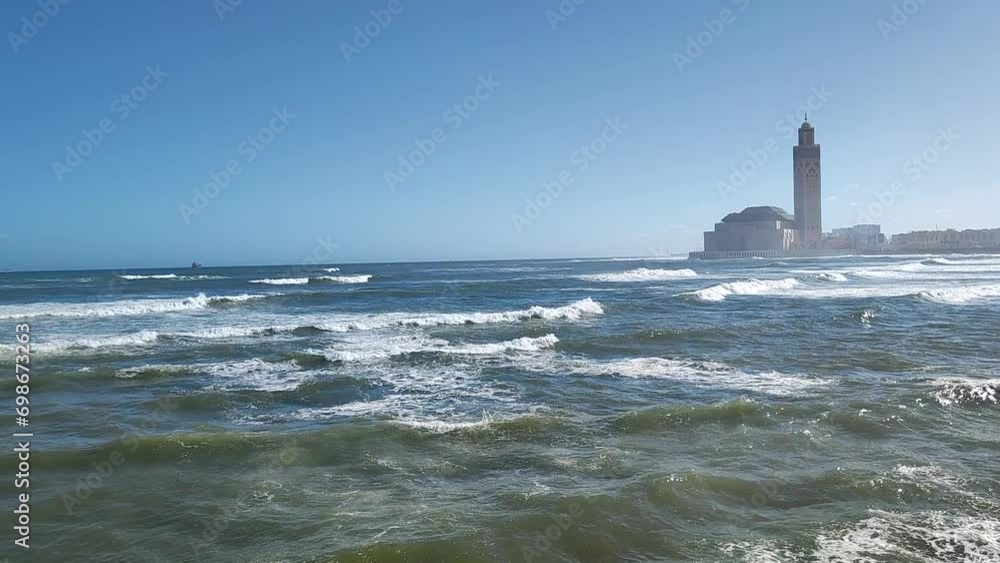 Seaside with the Hassan 2 mosque in the background - Casablanca - Morocco. Seaside with the Hassan 2 mosque in the background - Casablanca - Morocco.